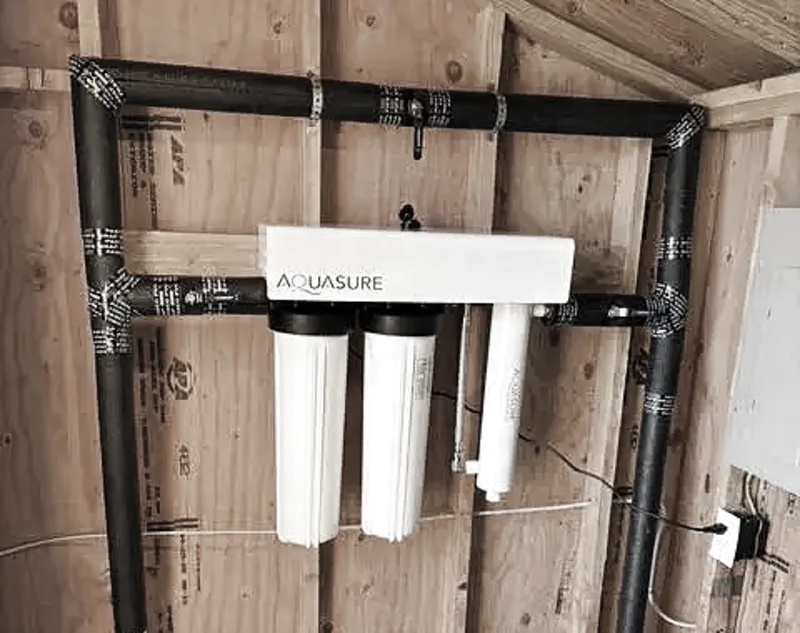 A whole-house water filtration system installed by Wild Pine Plumbing